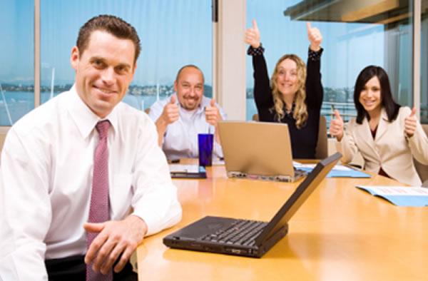 Group of executives smiling during meeting